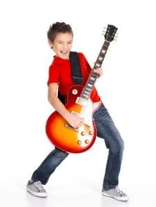 teaching a child to play guitar